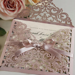 Elegant Wedding Card beside a Wedding Flower Arch