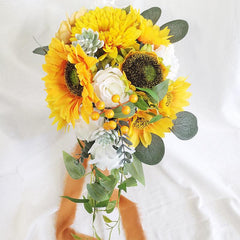 European style simulated sunflower bouquet with water drops in hand