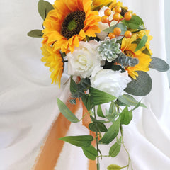 European style simulated sunflower bouquet with water drops in hand