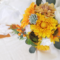 European style simulated sunflower bouquet with water drops in hand