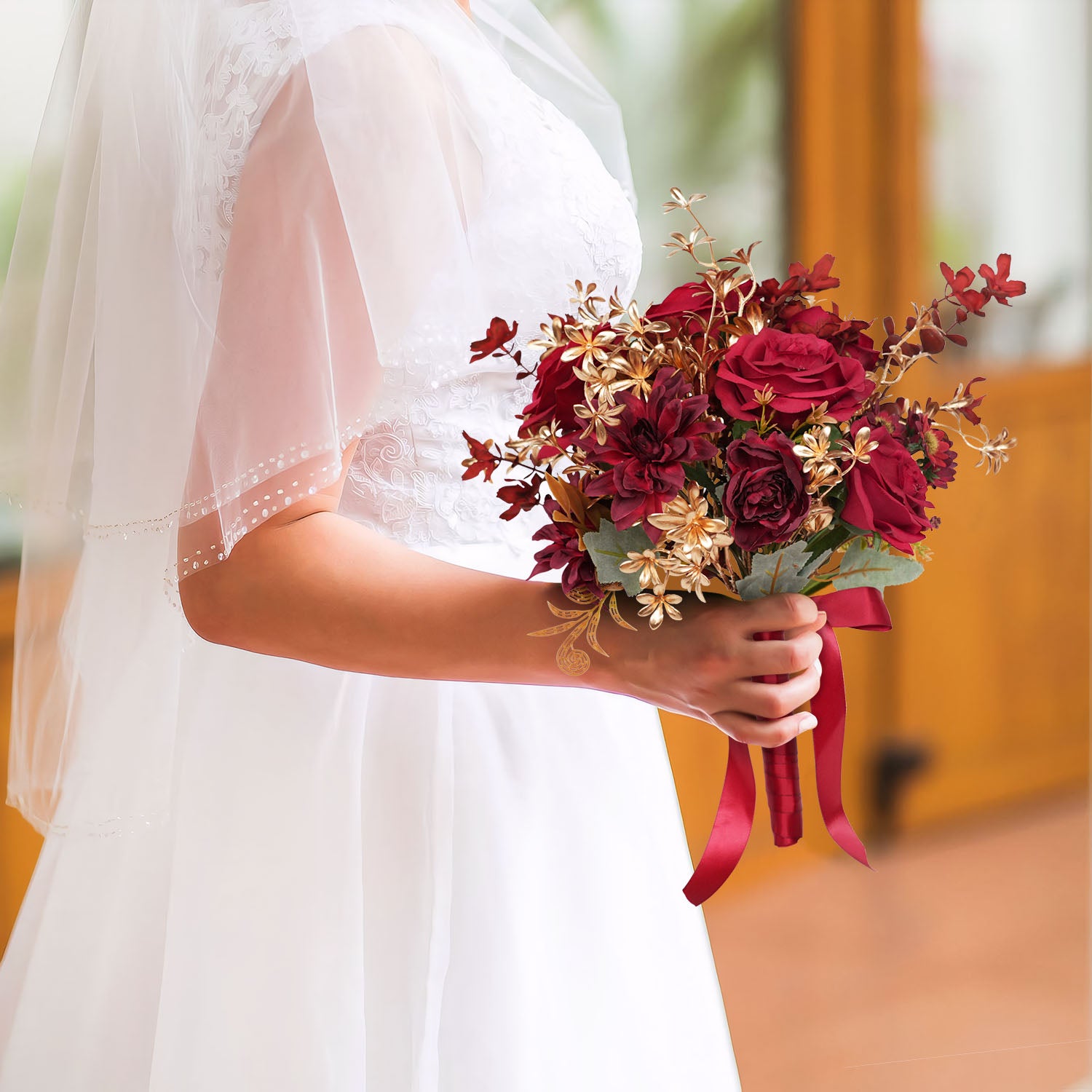 Burgundy wedding bridal bouquet with metallic foliage