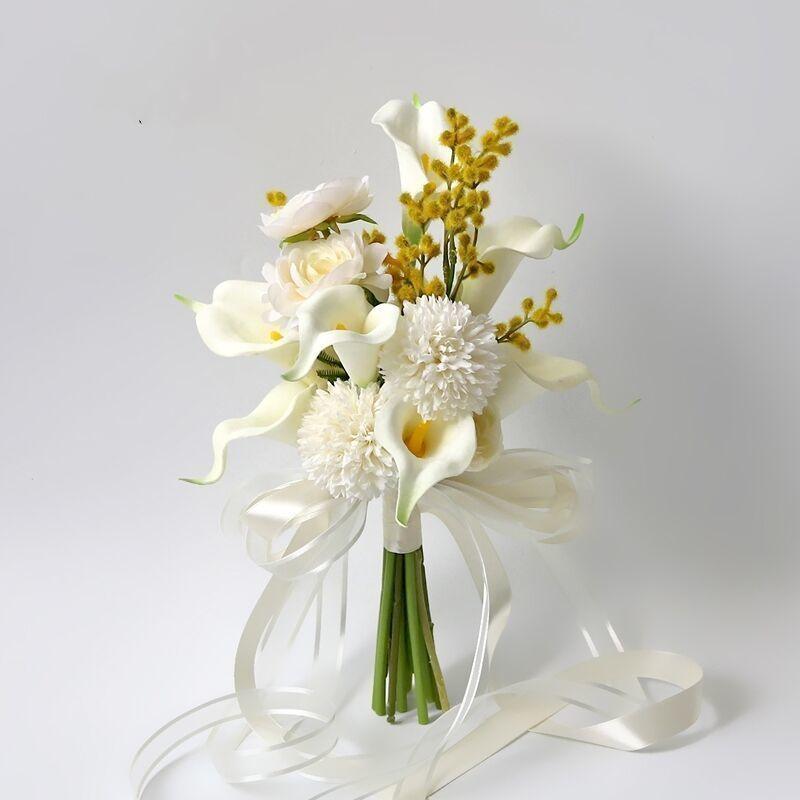 Simulated bride holding flowers wedding arrangement